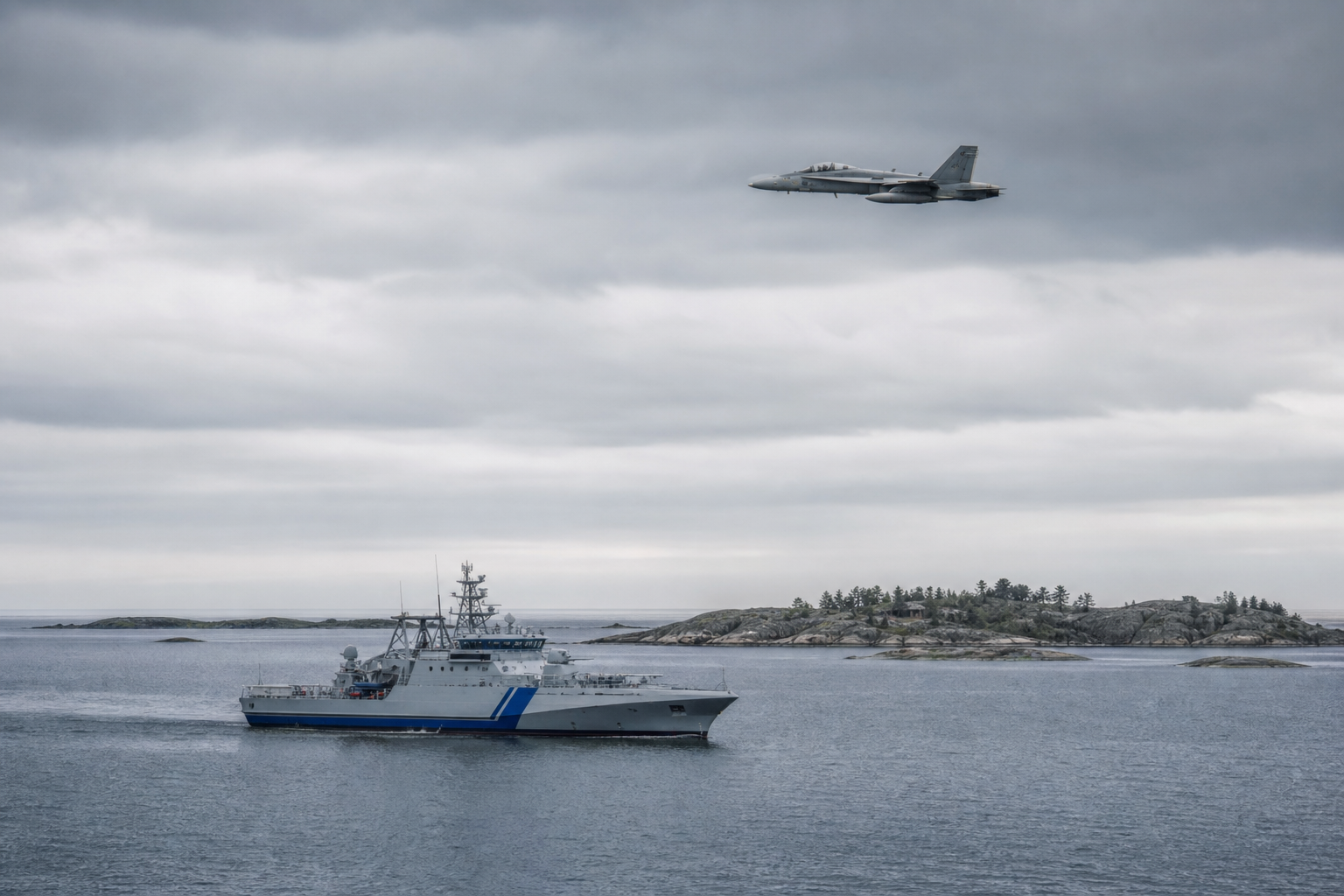 Rajavartiolaitoksen vartiolaiva ja Hornet-hävittäjä partioimassa merellä Utön eteläpuolella.